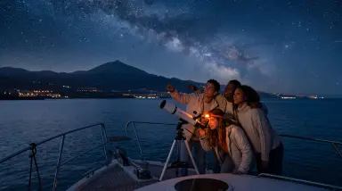 Group Stargazing on Boat at Night