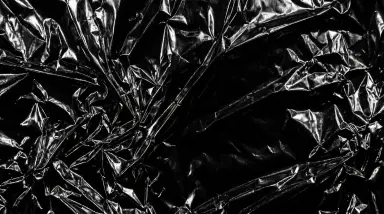 Black metallic foil texture background