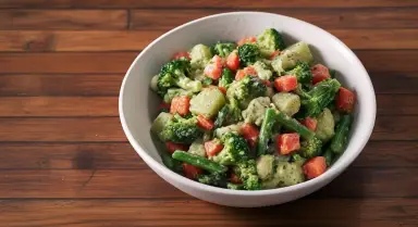 mixed vegetables in white bowl on wood